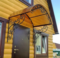 Кованый козырек на стену дома